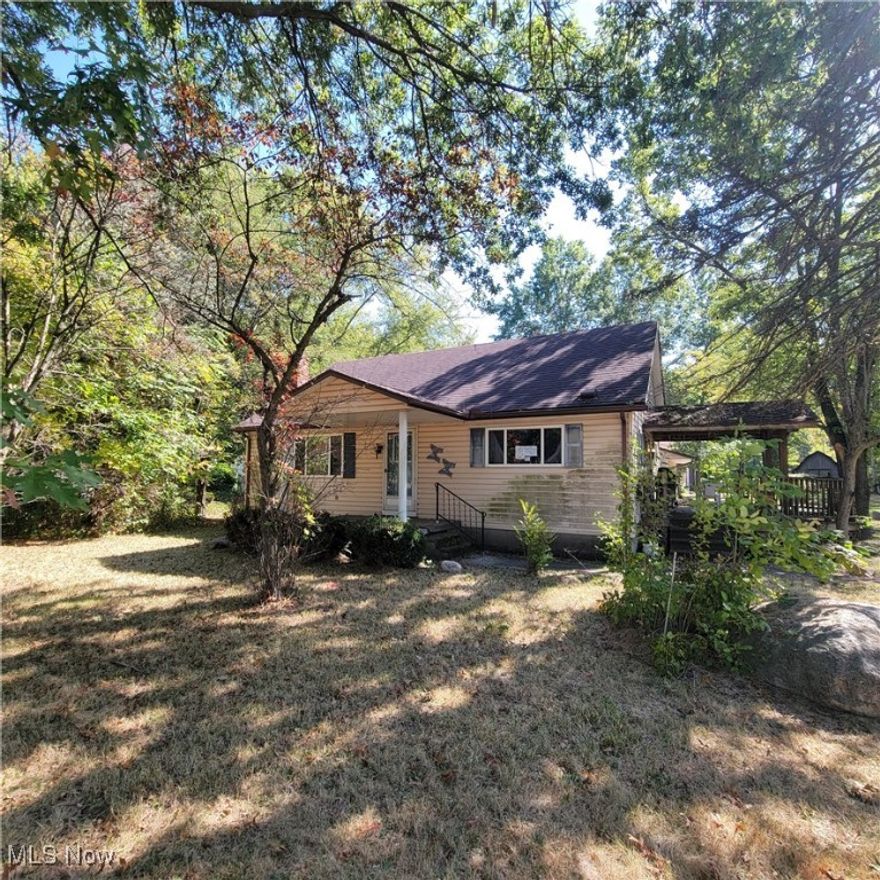 This spacious vinyl-sided Cape offers a versatile layout on a deep 1.85-acre lot with excellent indoor and outdoor features. The home includes a side deck and side porch, perfect for enjoying the expansive setting. An attached three-car garage provides ample parking and storage, complemented by an additional steel barn with three garage doors, ideal for equipment, hobbies, or extra vehicles.  Inside, the home features an eat-in kitchen, a living room with fireplace, a first-floor primary suite, a family room, and a laundry room for convenient one-floor living. Upstairs are two additional bedrooms, along with plenty of storage throughout.  With generous living space, outbuildings, and acreage, this property offers flexibility for a variety of uses.