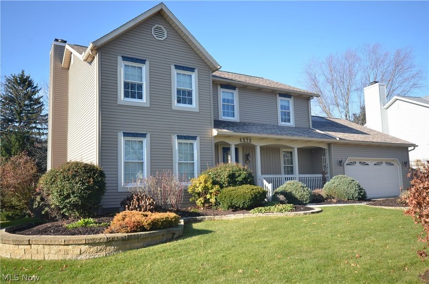 Giant Tallmadge Highlands Colonial w tons of updates (Roof, Siding, Windows, Furnace, AC, Kitchen & More) at a bargain price! Center foyer w tile floor & open spindle staircase flanked by formal dining w chair rail & living rm w French doors -open flow into the great rm featuring wall of built in shelving / cabinets & brick floor to ceiling raised hearth fireplace w mantle. Open layout from great room to eat in kitchen. Pergo wood laminate flooring in the eating area & kitchen w raised panel cabinets, high quality dovetail construction, decorative roping at the molding, solid surface counter w integrated sink & tile backsplash, Pantry closet. Sliding glass door from the eating area leads to the maintenance free covered Timbertech deck & paver patio. 1st flr “mud area” w closet – rear & gar access, ½ bth w granite counter & updated fixtures/mirror & spacious laundry rm w cabinets & util sink. Upstairs giant master bedroom w 2 closets (1 walk in) & big master bath w lg vanity, garden tub