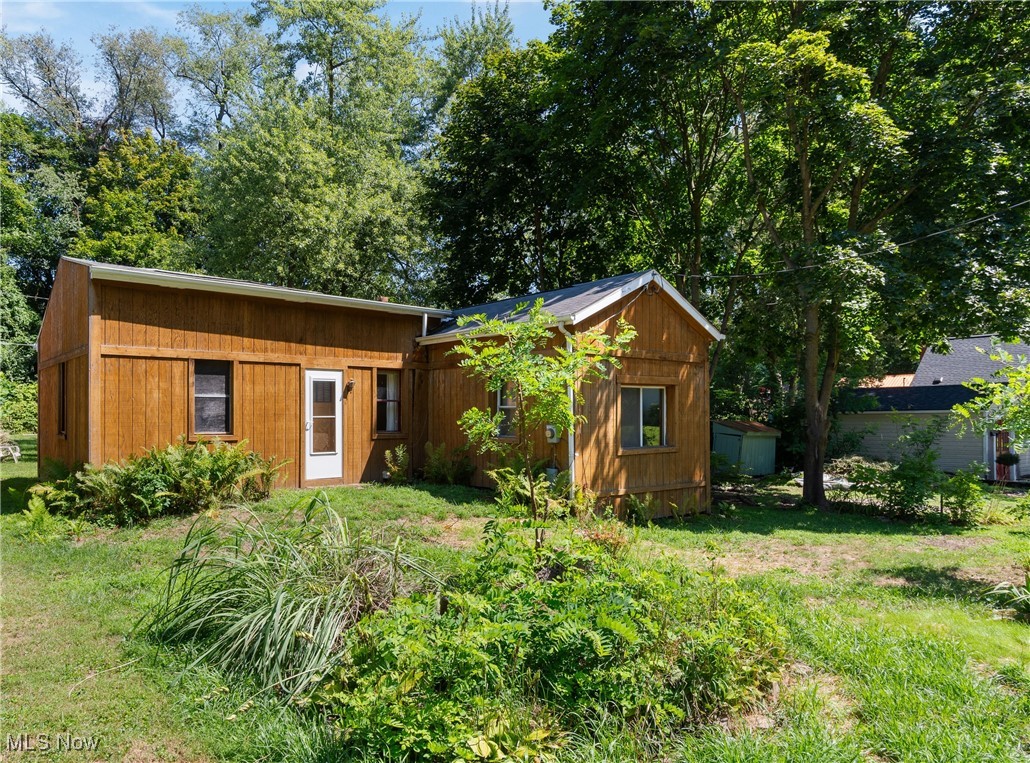 Unlock the potential of Portage Lakes! This charming cottage, perfectly situated between the East and West Reservoir, presents a golden opportunity. Whether you envision a lucrative flip, a high-demand rental income stream, a cozy lake retreat or your personalized dream home, this property offers endless possibilities. Currently featuring 2 bedrooms, a full bath, kitchen, living room, and a partial basement, this gem is prime for those with a creative flair and desire for serene lake living. The community of Shore Acres offers an optional association membership providing access to community beach & picnic area, with affordable boat slip rentals also available. Perfect for the creative investor, weekend warrior, or someone looking to dip their toes into lakeside living. This isn't just a house - it's an opportunity wrapped in potential! Don't miss out – seize this Portage Lakes treasure!