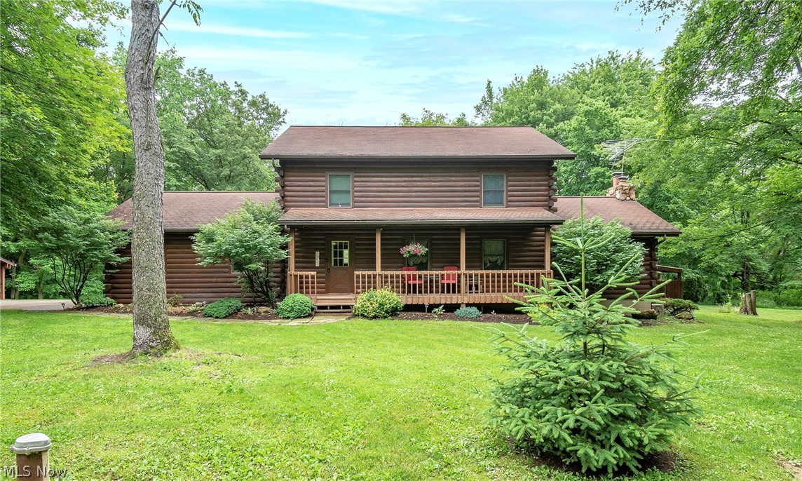 Welcome to 13334 Wallet Drive! Sitting on almost 5 acres, this stunning log cabin home boasts 3 bedrooms, 4 bathrooms, an in-ground pool, new pole building, and so much more! The family room provides vaulted ceilings with exposed beams, a wood burning fireplace and a sliding glass door that opens to the deck. The main level also includes a kitchen with extra cabinetry above the island, dining room with large bay window overlooking the pool, and oversized living room. Owner's suite complete with owner's bath and bedroom with private deck overlooking the pool and backyard. Remaining two bedrooms and full bath also on upper level. Half finished walk-out basement boasts plenty of storage and a spacious family/media room with a wood burning stove. This beautiful pool and large deck make this home great for entertaining! Large new pole building built in 2018, 2 car attached garage, and 1.5 car detached garage with a room on upper level. New geothermal unit Dec 2021. Dolphin automatic pool cleaner conveys. Schedule your private viewing today!