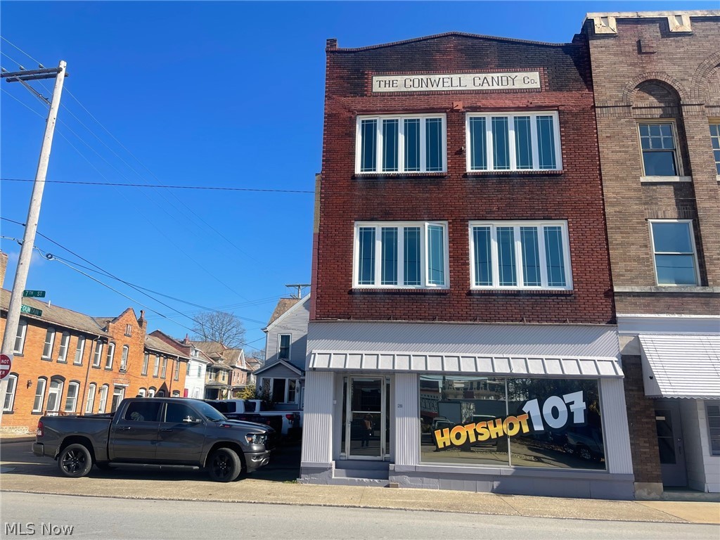 Includes parking! Downtown commercial space with side parking lot. Downstairs tenant (office space) pays $800 per month and is leased until September 2023. Upstairs apartment is $650 and also has a lease until December 2023. Upstairs Tenant to install a kitchen and finish drywall per the lease agreement. Both of the occupied spaces are very nice! Remainder of the space is unfinished, however has been roughed in with drywall, newer windows, and roughed in bathroom. Would be excellent for additional apartments or a live in/work environment! In addition, The City of Zanesville public lot is directly across the street for additional parking. New condenser unit installed in May 2022. Plumbing has been updated on the occupied apartment. No showings on occupied apartment until an offer has been accepted. 24 hour notice required for downstairs office showing and must be during business hours.