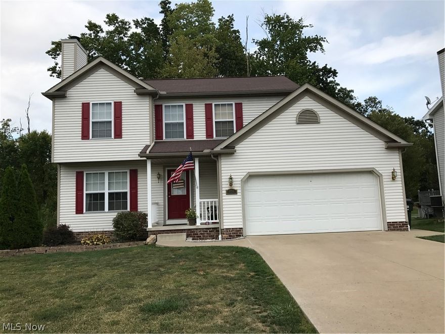 NEW PRICE! Very spacious open concept home. Fresh paint, new vinyl floors, new stainless steel appliances, first floor laundry. Eat in kitchen overlooking deck. The deck overlooks the woods and creek--enjoy morning coffee or dinner with friends outside. 3 bedrooms upstairs including over-sized owners suite with soaking tub and separate shower with large walk-in closet. Enjoy entertaining by the fireplace in the living room, or go downstairs to the full walk-out unfinished basement for even more room (pool table stays). Kitchen appliances included (washer, dryer and grill negotiable). Short dead-end road--great to let your kids play freely.