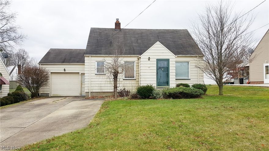 Affordable 3 bedroom cape cod in a great Struthers neighborhood! Features an attached garage with door leading to large fenced in lot!  The main floor has a large living room with hardwood floors, 2 bedrooms, full bath and spacious kitchen with dining area. The large 3rd bedroom with hard wood floors is on the second floor. Many possibilities in the partially finished basement. Home has newer windows. Definitely a must see! Priced to sell!