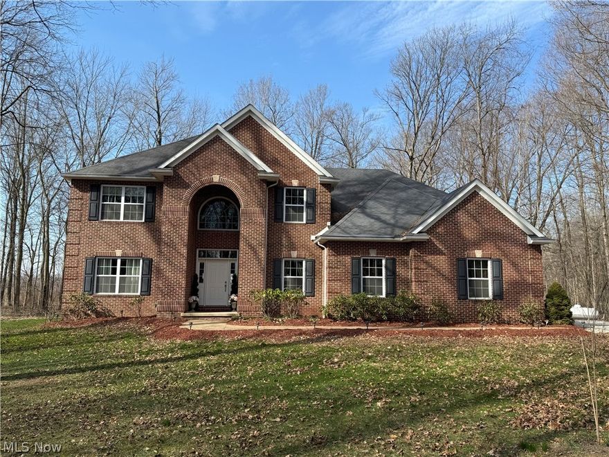 This is a rare opportunity to call this 3.6 acre escape your home. This newer build set far back off the road offers a quiet level of living as you're surrounded by the sounds of your own Metropark. Enjoy the colors and sounds of your own forest from your patio or hot tub! This home offers a 3 car garage and two outbuildings with plenty of land to make it your own. A popular metropark Mill Hollow is right down the street.

The main Level offers a large living area and updated kitchen. There is room for an office and formal dining room immediately off the entrance. The kitchen offers multiple islands and a walk in pantry with all stainless appliances. The large living room feels open and warm with the assistance of a large fireplace featuring custom tile work. Keep the outdoors outside with a large mud room off the garage entrance and a huge first floor laundry. If that wasn't enough there is your very own THEATER ROOM EASILY CONVERTED TO A 4TH BEDROOM. Upstairs you will find 3 bedrooms of which two are very large. The master bedroom has two walk in closets and a custom electric fireplace with custom tile work matching the headboard. The master bath has a double vanity with ample storage. The large walk in tile shower has two shower heads and the tub has one of the best views on the property. The unfinished basement has endless opportunities and spans most of the house. The basement is equipped with a sump pump with battery backup. The entire house had the carpet redone in 2021 and is top of the line. The gutters were recently fitted with gutter guard allowing for maintenance free living.

Homes like these don't come up for sale very often, This home is truly in showroom condition and ready for you to move right in. Don't let this Amherst retreat get away! Call and schedule your showing today!