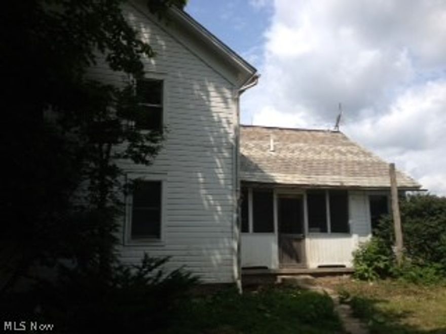 2 story colonial style century home with 4 Bedrooms!  2 car detached garage.  Great country setting on 8.8 acres.  Large barn with unlimited possibilities!