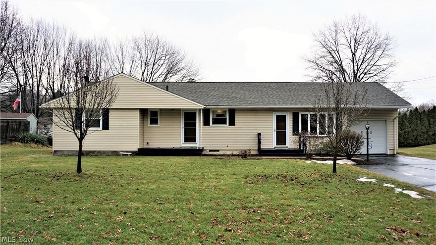Excellent opportunity in Tallmadge! Walking distance to new middle school and elementary school campus currently under construction. Roof, siding and storm doors replaced in 2012 give the exterior a fresh look. Eat-in kitchen has oak cabinets including a massive cabinet pantry, ample counter space with knee hole perfect for a make-shift office. Arched entry-way leads to a formal space that includes a dining room and family room. Family Room has wood burning fireplace with brick surround, stone hearth and wooden mantle. Picture window over-looks backyard. Off the eat-in kitchen is a large finished breezeway. Breezeway has a beautiful bay window with views of front yard and access to giant Three-Seasons room. Breezeway also has access to the single-car attached garage. Three-Seasons room has new carpet and walls of windows providing plenty of natural light and a door for access to unique covered patio constructed of multi-colored brick pavers. Sleeping quarters include 3 bedrooms and a f