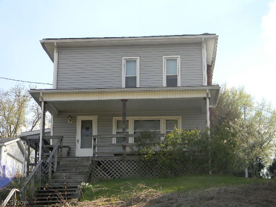 Large 3-4 bedroom, 3 bath family home. There is a bedroom, living room and kitchen area in the upstairs with an entrance. Large front porch, detached garage with parking area. Nice yard area for the kids to play. Great price, don't miss out. SOLD AS IS. No repairs or inspections done by seller.