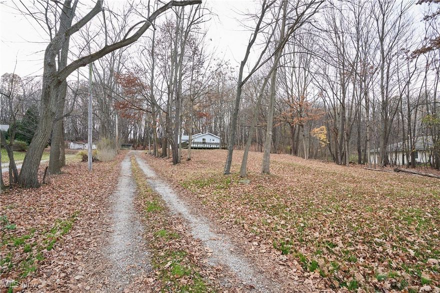 Updated Ranch on almost 1.5 Acres of wooded property. This home features a large deck, open floorplan, 2 remodeled full bathrooms, LVT flooring throughout and an attached garage, the side entrance takes you directly into the first floor laundry/mud room. Three nice size bedrooms including the main bedroom with its own private bath. This lot gives the owner a sense of privacy being set back from the road and partially wooded, while still having great accessibility to grocery stores, shopping, and restaurants. Call today for your private showing.