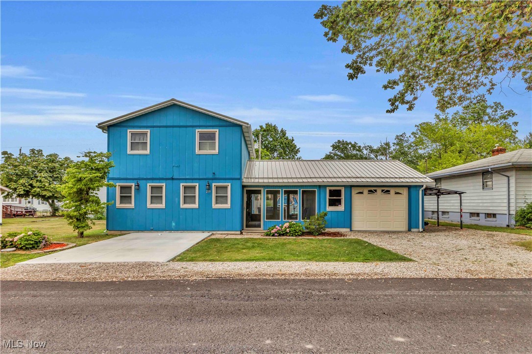Have you dreamed about living close to Lake Erie with sunset views! Welcome to your home away from home! This adorable 2 bedroom, 1 bath home is ready for you! Lake Erie is just steps away! Metal roof was installed in 2021 with a transferrable warranty, AC 4 years old, newer windows, updated electrical panel, all appliances are less than 2 years old. Enjoy your summers in the above ground pool! New liner just installed, relax in the hot tub that conveys with the property! The screened in porch offers the Lake Erie breeze! The garage also has a built-in compressor that will stay with the property and has a heater! Amazing opportunity to live close to Lake Erie!