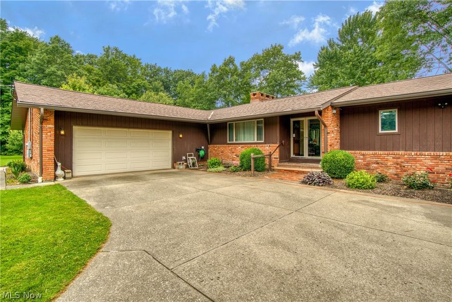 Enjoy this beautifully updated private oasis that is conveniently located within walking distance to playgrounds and close to shops, restaurants and freeway access. When you enter this sprawling ranch home you will be greeted by the warm living room with wood burning fireplace to keep you cozy in the winter. If you head to your right, down the hall you will see that this wing of the house offers 3 generous bedrooms and 2 full bathrooms. Opposite the foyer is a light filled den/office that is right off the expansive kitchen open to the inviting dining area complete with a full brick wall fireplace that will make a huge statement to all the guests you will be able to fit in this gathering area. The kitchen has had a total make over in 2022 which includes custom cabinets, quartz counter tops and all new appliances. Every detail has been meticulously thought out in the design and function of this spectacular kitchen. Just off the kitchen is the half bath and the very inviting family room that offers tons of windows, vaulted ceilings, custom beams and new carpet. Outside you will absolutely love the low maintenance composite deck right off the dining area that has plenty of space for you to sit and enjoy your vast 1.55 acre lot with gorgeous mature trees and fire pit for chilly nights. You can bring your creative side out in the clean, dry unfinished basement that is just waiting for your imagination. This property is unlike many in the city as it is a large lot on a private dead end street and has many updates including new LTV flooring and hot water tank 2021. You must check out this wonderfully maintained gem, I assure you it will not disappoint!