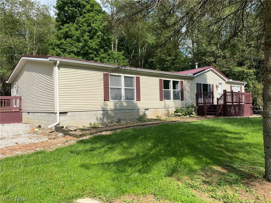 Welcome to the peace and quiet of this beautifully renovated home on 7+ acres.  Located in the heart of Mohican country and only a short drive to Charles Mill Lake or Pleasant Hill Lake.  This large sprawling ranch includes 3 bedrooms and 2 baths.  You'll love the spacious open kitchen leading into the dining room and large living room with a wood-burning fireplace.  Updates include whole house renovation in 2016, freshly painted throughout and metal roof in 2020.  Everything is done, all you have to do is pack your bags and move right in!  The home is wired for a backup generator allowing you one less worry.  Both the 2+ car garage and sheds have electric on a separate breaker.