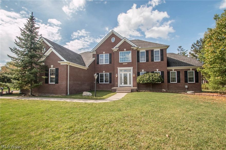 Custom Built, Classic Brick Front Colonial built in 2002, nestled on an oversized lot in Strongsville! This beauty showcases over 5,700 total sq.ft, 4 bedrooms, 4.5 baths, sunroom, 2nd floor bonus room & huge finished basement. Extra storage space in unfinished attic, finished storage room in basement & oversized 3 car side load garage. Grand 2 story foyer & gracious staircase w/ wrought iron spindles. Private office w/ custom built bookshelves. The elegant formal dining room leads to the eat-in kitchen w/ maple cabinetry, black galaxy granite counters, planning desk, stainless appliances w/ double oven, breakfast bar & sunroom! The impressive great room boasts a wall of windows accented by a custom entertainment mantel, beautiful stone fireplace & soaring ceilings. Private 1st floor owner's suite w/ vaulted ceilings, large walk-in closet & glamour bath! The powder room, oversized mud room & laundry room complete the main level. Upstairs you will find 3 more sizable bedrooms, a 16x10 f