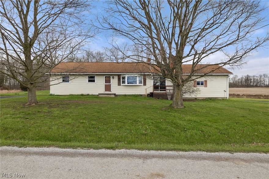 Check out this 3 bedroom Ranch on 2 acres!!  All new paint throughout, new carpet in all 3 bedrooms.  Large Living Room with electric fireplace.  Eat-in Kitchen with a lot of cabinets and counter space.  Full bath on the main floor and half bath in the basement.   Large outbuilding.   Mapleton Schools.  Call today for a private showing.