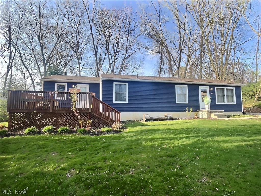 Welcome to 27 Weil Ave. This Portage Lakes property offers 3 bedrooms, with the potential for 5, & 3 full baths. A cozy, private mother-in-law suite with a wood-burning fireplace on the main floor makes this property stand out from the rest. The sizable and timeless kitchen offers plenty of beautiful cabinetry, countertop space, and brand new appliances making this ideal for those that love to cook. The living room offers the perfect balance of feeling cozy & open. 3 bedrooms & 2 full baths conveniently located on the main floor, with 1 full bath recently remodeled & the other offering step in shower. Laundry hook-up available in bedroom closet on main level to move upstairs. Downstairs, you will find a full bathroom just needing finishing touches, a potential 4th bedroom, built-in shelving for storage, laundry area, bar, & pool table room. 8x8' shed in backyard to house all your outdoor tools in addition to side front deck to enjoy your morning coffee. Water heater only 5 years old, Furnace & A/C only 2 years old, and brand new kitchen appliances. This home is perfect for spreading out, guests or extended family, providing both independence and comfort. Here, you will also find a work space as well as extensive storage space with shelving. This stunning Lakes property has so much to offer, schedule your showing to appreciate the beauty of this home in person!