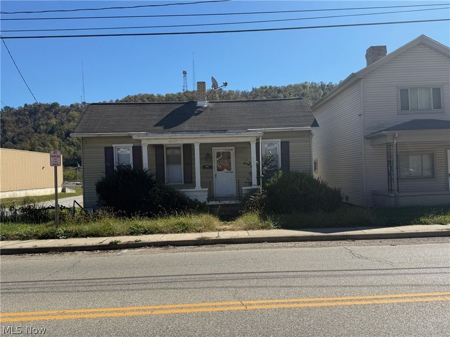 One story home located on National Road in Bridgeport. One bedroom home with another bedroom being captured with a full bath and living room. Downstairs consist of kitchen, bonus room and laundry/ utility room. Home has a fenced in backyard.