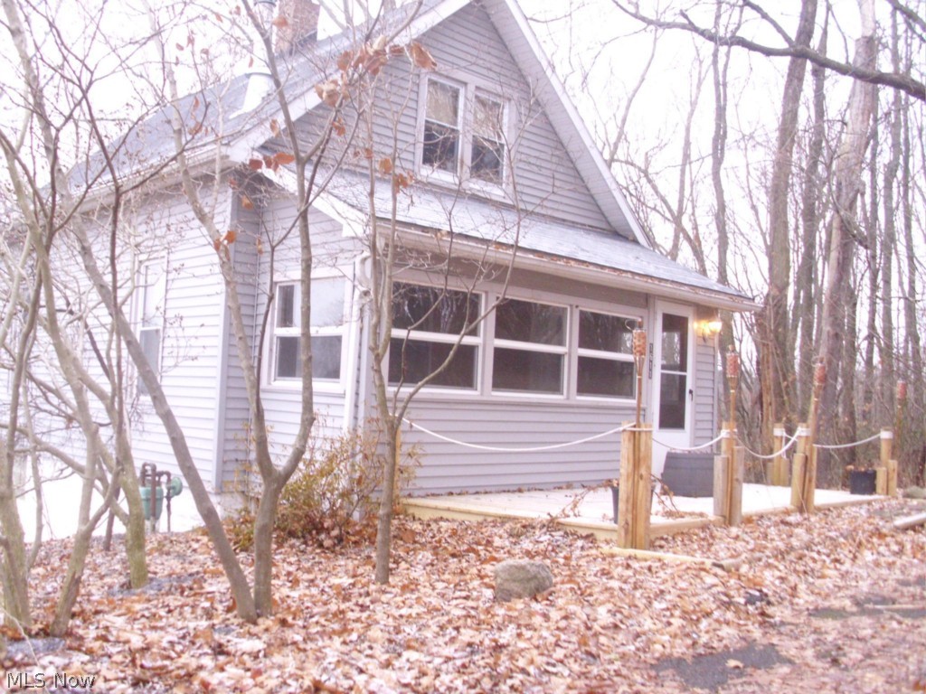 Private living with city amenities. Three bedroom, two bath bungalow with finished attic. Last house on a dead end street with a double lot, .67 acres! The living room features a woodburner that helps reduce the heating costs. Rustic dining room for entertaining. First floor bedroom and bath. The full, walk-out lower level has a full bath and recreation room that has a woodburner, bar and a hot tub. Roof approximately 6 years old. The enclosed front porch can be used most of the year. Siding and windows approximately 9 years old. The large back yard is completely fenced in for family fun or pets. This home has a new deck on the front and side deck for entertaining. Move-in ready, a must see.