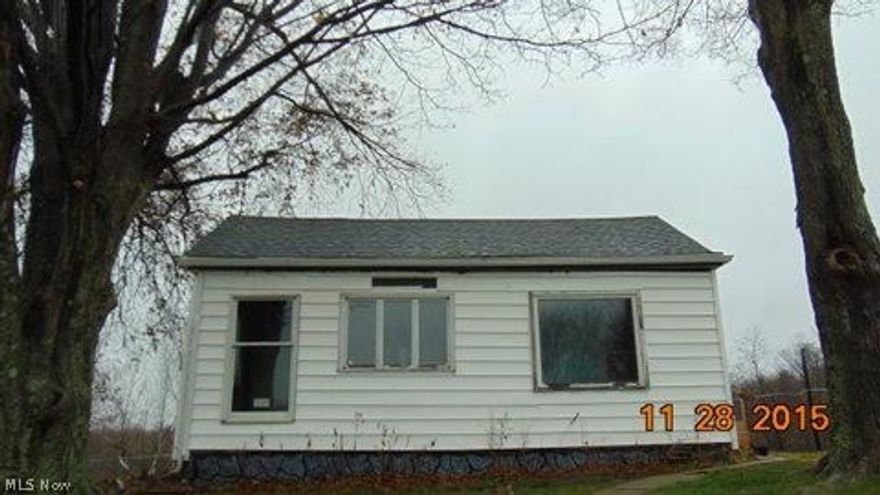 2 bedroom 1 bath bungalow on over 2 acres with a large single-wide on the lot.