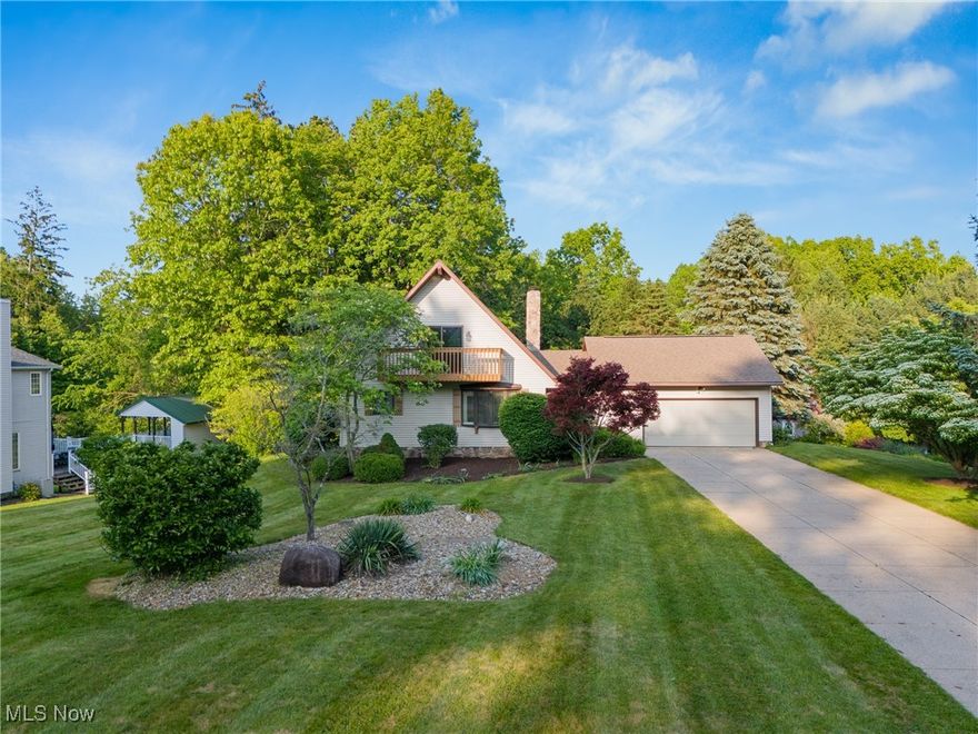 Welcome to 6791 Cedar Ridge Trail — a one-owner, custom-built home nestled in a serene, wooded setting. Step into the spacious foyer and be greeted by a stunning two-story great room featuring a gas fireplace and a wall of windows that flood the space with natural light while offering tranquil views of the private backyard. If you love the outdoors, this home was made for you — with three separate decks, a landscaped yard, and a decorative pond complete with a charming bridge, you'll enjoy peaceful moments in every season. The oversized eat-in kitchen comes fully applianced and offers ample cabinet space, a large pantry, and plenty of room for entertaining or family gatherings. You’ll also appreciate the convenience of a main-floor laundry room, complete with washer and dryer. The first-floor primary suite is a true retreat, featuring a private deck and a spacious en-suite bath with a soaking tub and a walk-in shower. Upstairs, you'll find a large loft-style bedroom with excellent closet space and a private full bath, complete with a skylight and walk-in shower, offering privacy and comfort for guests or additional household members. The finished lower level adds even more livable space, perfect for a home office, rec room, or hobby area, along with plenty of storage. Located in the top-rated Green Local School District, this thoughtfully designed home is ready for its next chapter. Schedule your private showing today!