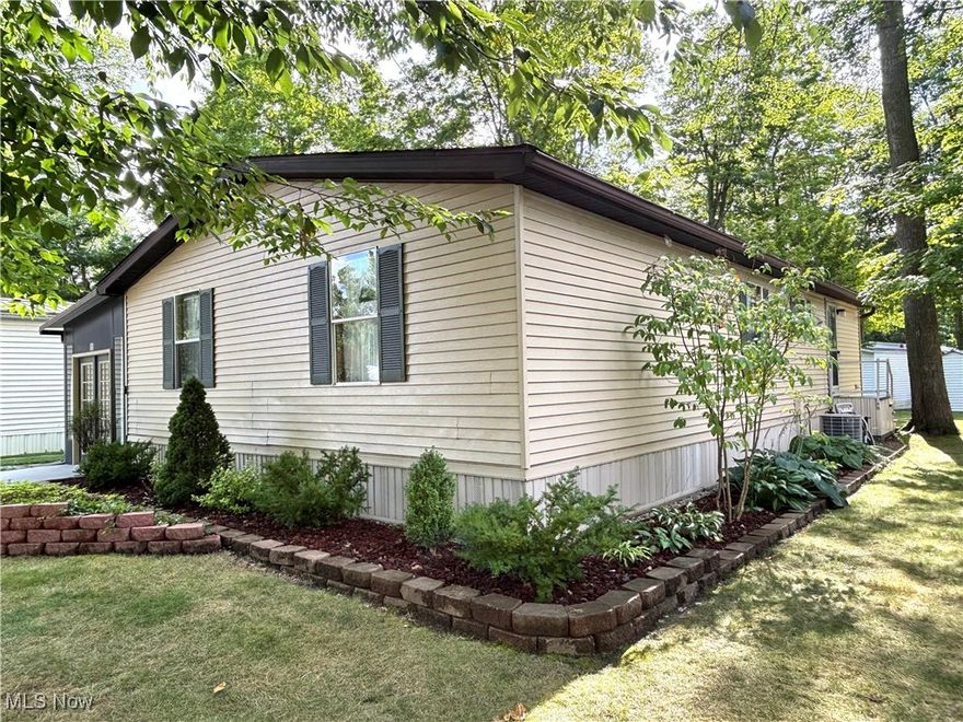 This is truly an amazing home in Southern Terrace Mobile Home Park AND INCLUDES ALL FURNISHINGS. This home features 1152 sf of beautiful living space, totally updated. The breezeway is filled with natural light with windows along the entire side, the perfect place to relax. Entering the home, you see an open living space. This home is amazing, with the comfortable living room, dining area, and new kitchen. The kitchen features new cabinets and countertops, large island with lots of storage, pantry, stove, refrigerator, and microwave.  Dining area open to kitchen and living room. Master bedroom with new carpeting, private bath with new flooring, custom vanity, walk in shower, and spacious walk in closet. Two additional bedrooms and bath.  Laundry room next to kitchen for added convenience. High efficiency gas furnace and central air provide year round comfort. Storage shed opens from breezeway for easy storage. This is truly a move in ready home, and includes all furnishings and appliances. Monthly lot rent $445 includes trash service. You will want to see this home and all it has to offer! Ready for immediate occupancy.