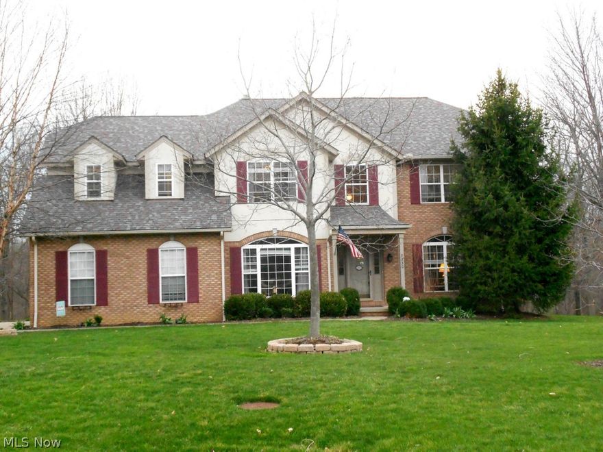This amazing 4 bedroom, 2.5 bath colonial has it all! Open concept living with neutral & Pottery Barn colors! Formal living room & dining room feature crown molding, stunning hardwood floors accent dining room & gorgeous kitchen with cherry pull out cabinets, SS appliances, granite, island, pantry, & desk area. Large dinette area has sliders leading to two-tier deck & sensational treed yard complete with play gym & child's castle. French doors open to private first floor office, vaulted family room offers newer skylights & beautiful brick fireplace. First floor powder room & convenient first floor laundry. Master suite with vaulted ceilings offers double sinks, walk-in shower, Jacuzzi tub, & walk-in closet w/organizers. Additional three bedrooms are spacious w/nice closet space.  Finished lower level is a real gem with three living spaces (office/craft area, recreation room & a reading nook under the steps!). Newer roof 12/2013.   Home warranty offered. Invisible dog fence.
