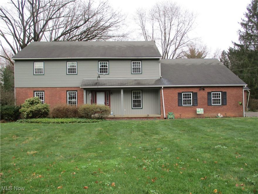PHENOMENAL PRICE ADJUSTMENT! OWNER IS MOVING SOON AND WANTS YOU TO TAKE ADVANTAGE OF THIS FANTASTIC INVESTMENT OPPORTUNITY! This Grand traditional Colonial, on an acre lot, on a private, circular street with 5BR's, 3 1/2BA's, an attached double garage, plus a separate, oversized single garage, 3,240 sq.ft. of living space will amaze you. Vinyl siding. Polaris windows. Rear deck. Concrete driveway. Elegant Entry Foyer with exposed staircase to the 2nd floor, double guest closets, slate flooring. Den/Office with built-in shelves and desk, carpet, wood paneled walls. LR and DR are spacious and welcoming. Cheery, equipped Kitchen with dinette area, all appliances included. FR with fireplace and full-brick wall accent, access to the enclosed rear porch and deck. Half Bath in the hallway to the 1st floor Master Bedroom Suite with large closet/storage, on-suite Full Bath and access to the enclosed porch and the side entrance to the house. Four oversized bedrooms on the 2nd floor which includes another MBR with its own Full Bath and a Full Bath off the hallway. Access door in the front BR to stairs to the floored attic area. Full Basement can easily be finished to your liking, laundry area, 2 gas, forced-air furnaces plus 2 C/A units, sump pump, 150 amp. elect. service, plus space for everyone and everything. Quiet, low-traffic, sought after street. Claim this one as your new home now! Call today for your viewing! Won't last long on the market!