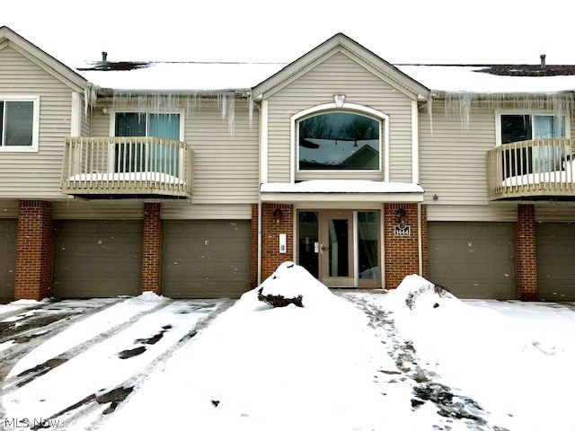 Looking for maintenance-free living close to highway access? This condo is the one for you! This 2 bedroom, 2 full bathroom condo features an open floor plan and vaulted ceilings in the main living space. The master suite includes a walk-in closet and full bathroom. Another full bathroom is located near the large second bedroom. Enjoy the balcony overlooking the pool. This condo has a secure keyed entry, attached garage with storage, inground pool, fitness room, and clubhouse. Close to shopping, dining, and highway access. Why rent, when you can own this wonderful unit!