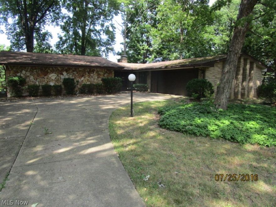 Enjoy living in this comfortable ranch located on a quiet street in Avon. Wooded lot. Custom tile work in foyer. Light and airy open living room with glass sliders out to serene back yard. Massive stone wall dual fireplace separates living room from formal dining room. Generous gourmet-style kitchen with center island cooktop, casual breakfast dining area, closet pantry, custom cabinetry and abundant counter space. Laundry room and access to attached 2-car garage. Spacious bedrooms. Bath with tub and dual vanities. Master with full shower bath. Fantastic area - close to schools, parks and retail shops. Needs some updating, but this is a true gem! NOTE: Additional parcel in rear (04-00-026-109-059) is not included in this sale.