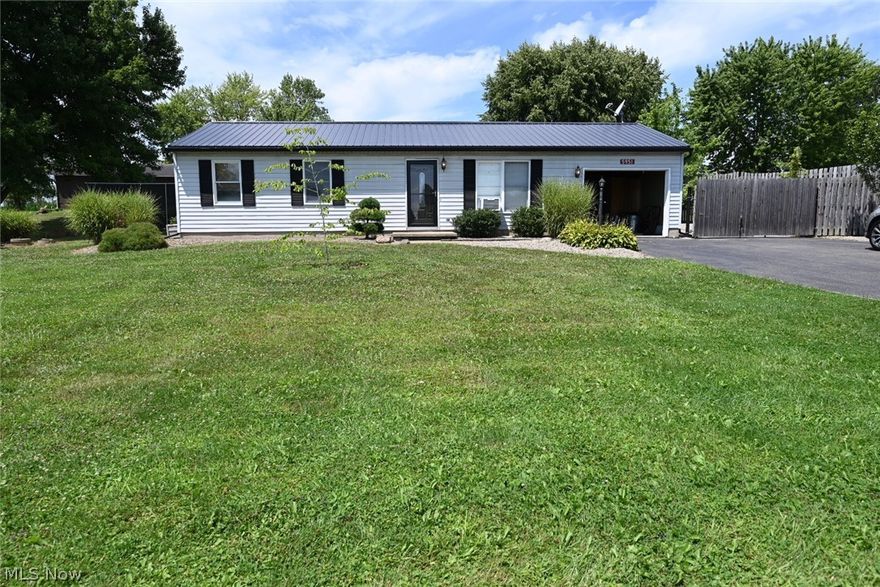 Updated and MOVE IN READY RANCH! Gorgeous Eat In White Kitchen features a Stone Backsplash and Stainless Steel Appliances which are approximately 6-7 years old. Home has been freshly painted in a neutral gray tone. Bathroom was Updated approximately 6 years ago. Laundry room and water softener off the kitchen.  Metal roof was installed 2018. The backyard offers privacy and a LARGE Covered Patio (approximately 36 x 16) for additional Entertainment space rain or shine! Beside the attached one car garage is additional paved parking behind a privacy gate. There is a 50 amp electrically outlet for an RV along side the paved parking.  Landscaping was just professionally trimmed. Home has no basement. Must see!!