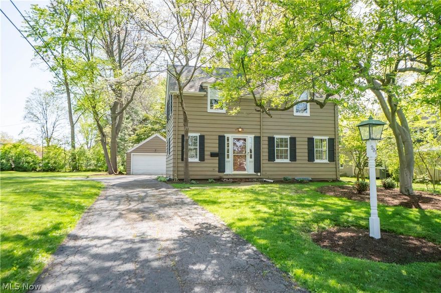 Full of warmth, charm, and timeless Colonial character, this beautifully updated home offers inviting spaces inside and out. From the moment you step inside, refinished hardwood floors, crown molding, arched doorways, and sun-filled rooms create a welcoming feel throughout. The foyer provides a practical drop zone for coats and everyday essentials before leading into the spacious living room, where built-in bookshelves and a wood-burning fireplace with gas starter set the tone for cozy evenings at home. French doors open to the Florida room, enhanced with new windows and offering a bright, relaxing space to enjoy your morning coffee, unwind with a book, or gather with guests. The formal dining room adds another layer of charm with two built-in hutches and direct access to the Florida room, creating an easy flow for entertaining. The kitchen features hardwood flooring, a pantry area, and appliances that stay, including the dishwasher and refrigerator. Upstairs, you’ll find two comfortable bedrooms, a remodeled full bath, hall closets, eave storage, and attic access. The unfinished basement offers valuable utility and peace of mind with laundry hookups, a concrete utility sink, glass block windows, waterproofing, two sump pumps, and a radon mitigation system. Outside, the large yard with mature trees creates a peaceful backdrop, complemented by a turnaround driveway and a 2-car detached garage. A charming, well-cared-for home with character in all the right places!