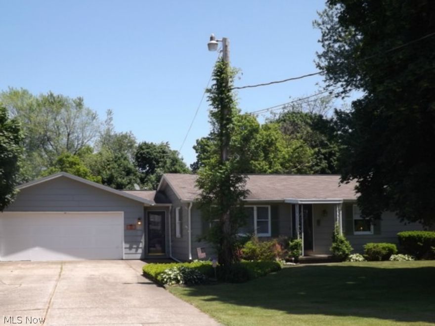 Absolutely charming three bedroom two full bath ranch with a large eat-in kitchen with breakfast bar. Most rooms have new laminate flooring and newer vinyl flooring. Enjoy the large pantry/storage off the kitchen. Laundry room is situated off the kitchen area with storage cupboards. Enjoy the large master bedroom with a large updated master bath that includes a shower and jet tub. The main bath has updates also. The attached garage has been finished off with cedar boards and has a side overhead door for easy access. The backyard is small but is enclosed with a wood privacy fence for your own private "Rose Garden" with lots of trees and flowers. Then enclosed back porch features a hot tub and nature stone flooring. There is a side yard that is great for swing sets and an area for the kids to play. Move in ready for a new owner.