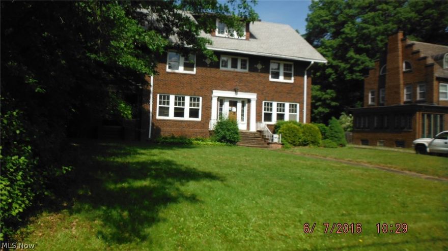 MUST SEE!! Large Brick Colonial featuring 5 spacious Bedrooms; 2.5 Baths.  Master Bedroom has adjoining bathroom and a walk out deck with a beautiful view.  An abundance of kitchen cabinets and counter space for that gourmet chef.  Dining room has built ins for extra storage.  Hardwood Floors throughout.  Cozy fireplace in this large living room with plenty of windows to allow the natural light in.  Great covered side porch to relax on during the warmer months.  Covered back porch area.  Entertaining will not be problem with this deep lot.  Schedule your showing Today and make this your home!!
