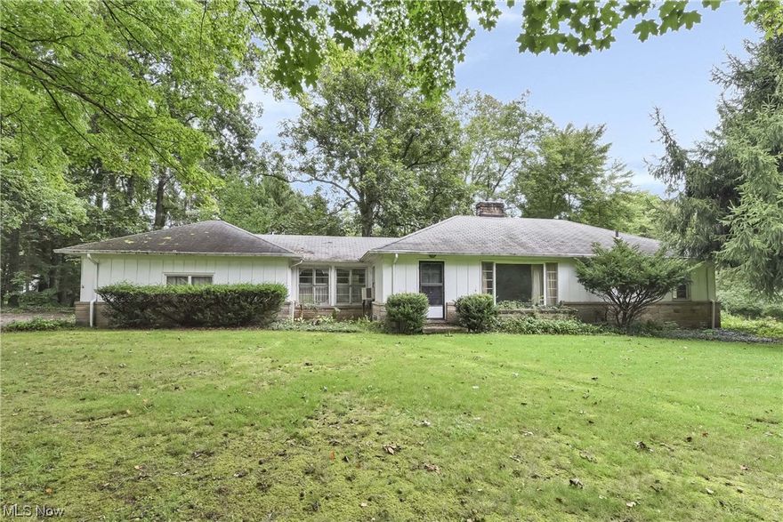 Prepare to be Moved! Huge double parcel with over 2 acres of tree-lined landscape providing privacy and serenity with a 1,300 square foot ranch located in the highly sought-after community of Solon. This is an amazing opportunity to make this special property your very own, bring your builder and dream home ideas or simply restore this home to suite your needs. Current home boasts 3 bedrooms, 2 bath, hardwood floors, fireplace in the living room, eat-in kitchen, bright windows to take in the scenery, partially finished basement, and enclosed breezeway connecting the 2-car garage to the rest of the house for easy access. Be sure to check out the drone photos for an idea of the true size of the land. Diagonal tree line approximately matches the separation of two parcels. 100 amp main breaker and underground feed from meter box replaced in 2019, furnace i n 2020 and well pump in 2021. Make a point to see this remarkable opportunity and take it from fixer to fabulous. Call to schedule your private tour today!!