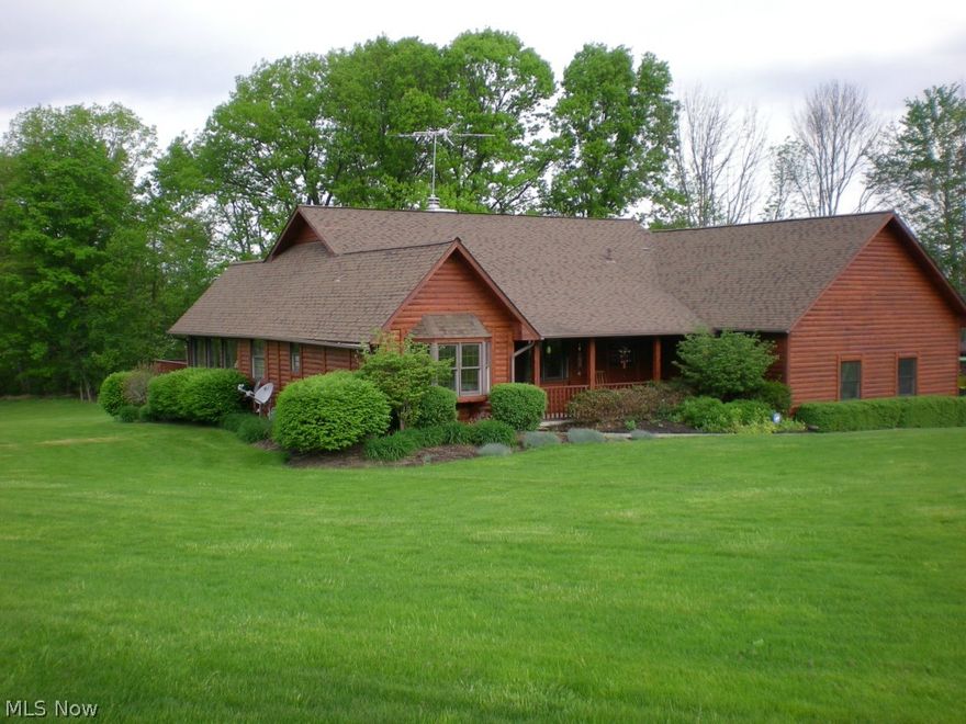 Sitting on 1.84 Acres is this "little bit country" quality ranch style Log home with 3 bedrooms & 3 full baths.  Features high ceilings, beautiful wood floors, central air & gas heat.  Kitchen with Oak cabinets opens to dining area.  Huge 30 x13 family/great room offers gas log fireplace. Master Bedroom with shower & Jacuzzi and walk-in closet.  Sun room leads to a 14 x 14 deck.   Cement driveway. Finished 3+ car garage. Open front porch.  Patio.