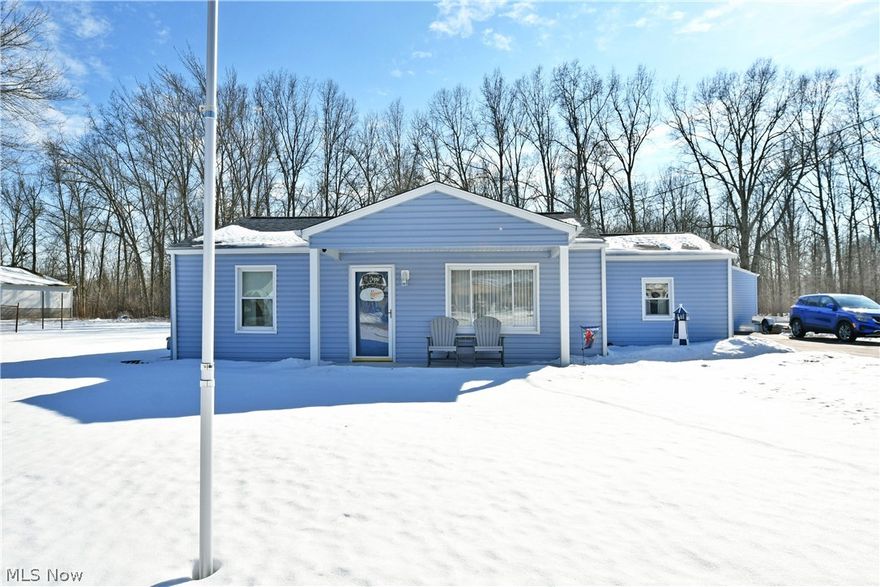 Cozy ranch comforts with a huge garage! What more can you ask for? Welcome home to this charming Liberty Township residence, located along a quiet, dead-end road that ensures low traffic and plenty of tranquility while you take in the woodland backyard views. The bright blue colors are an instant standout from the snowy ground, instantly endearing to create a sense of excitement. The covered front porch provides a formal entrance while a secondary side door makes everyday activities a breeze. Meanwhile, the massive four car capable garage awaits outback, joining a nearby raised deck; a perfect place for a hot tub or outdoor gas fireplace. Enjoy the views all year round from the comfort of the finished rear sunroom, a welcoming bonus. Inside the home, a gracious central living room takes full advantage of the large windows for natural illumination as hardwood styled flooring fills in underfoot. Around the corner, formal dining oversees the sunroom entrance while laundry service hides away around the corner to offset utility access. Whip up your favorite meals in the invitingly spacious kitchen where an array of warm wood cabinets greets your eye. Around the corner, additional storage makes a great coat room. Two sizeable bedrooms complete the package along with a tastefully updated full bath and its low entry shower. Call today for more!