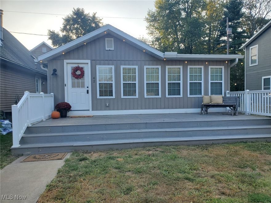 Fall in love with this stunning 3 bedroom lakeside ranch. Enjoy the views of this Luna Lake community on your spacious front deck or head down the street to the beach for swimming, fishing & boating along with picnic pavilions, a clubhouse, baseball diamond & playground. This one story home features a beautifully updated great room with built-in bookcases, fireplace and drop zone, open dining room and kitchen with white cabinets and newer counters, nice full bathroom with plenty of cabinets and first floor laundry. The many updates include a tankless hot water heater, furnace, electrical and plumbing. Vacation all year round in this home!