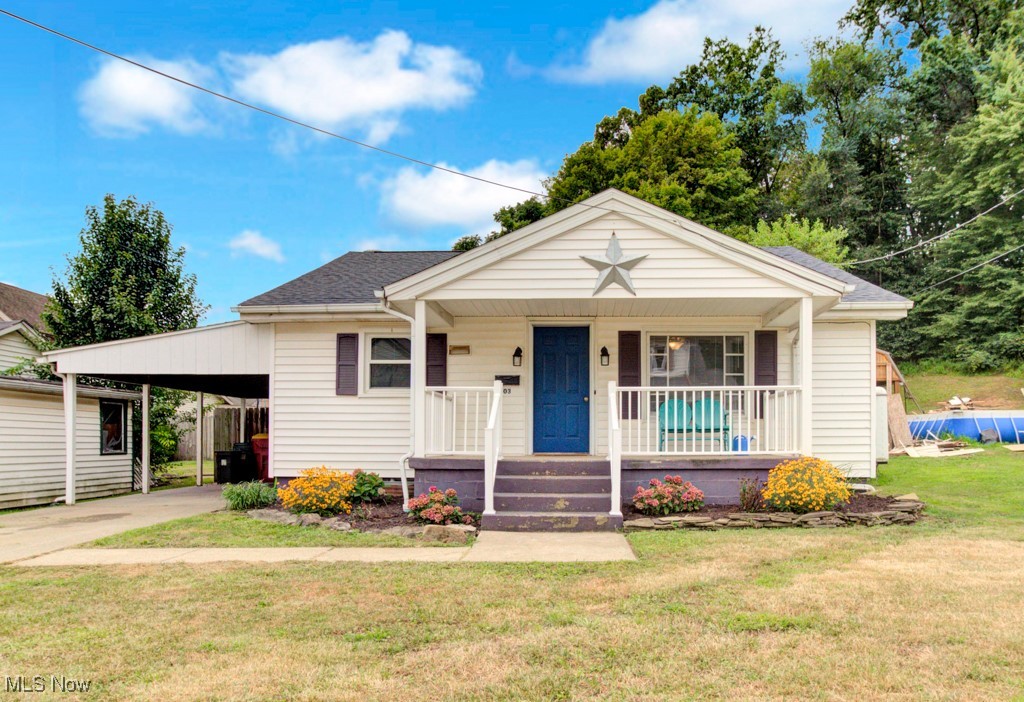 New listing in Minerva! Conveniently located close to downtown, this charming home offers an inviting open kitchen featuring a butcher block island, stylish tile backsplash, and warm beamed ceilings. The spacious living area flows to a wide hallway leading to two generously sized main-level bedrooms. Enjoy the walkout access to a fenced backyard—perfect for relaxing or entertaining! The lower level is partially finished with two versatile rooms, a full bath, storage area, and utility sink. Recent updates include a new roof (2024) and a newer drain system from the house to the street, providing peace of mind. Additional features include a carport, smoker and grill, washer/dryer, and appliances—all to convey. Don’t miss this move-in ready home with flexible living
