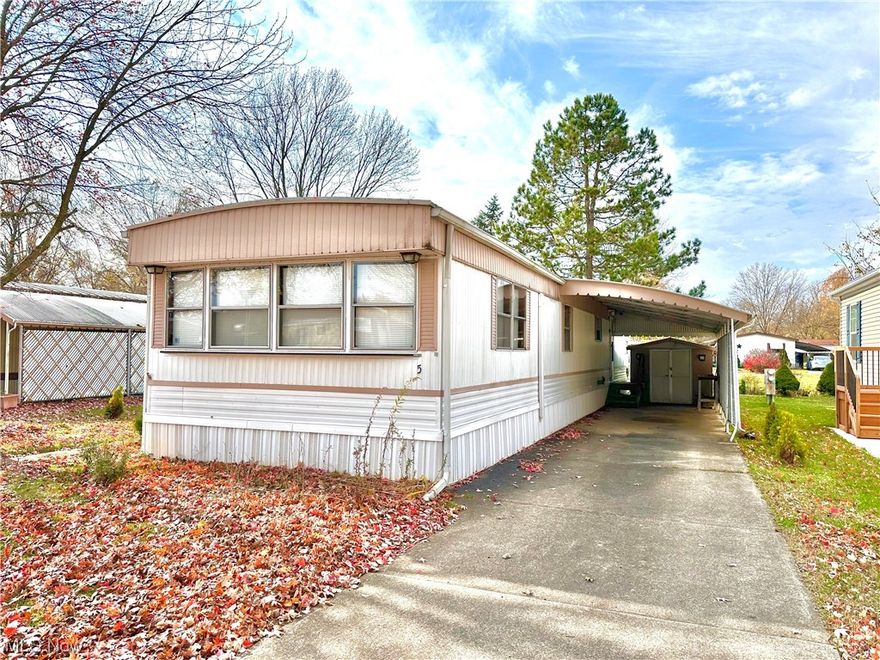 COLUMBIA PARK IS A 55 YEAR AND OLDER CONCEPT OF LIVING and is Ohio's Premiere Adult Land Lease Community! Amenities include: Gatehouse managed entrance, on site Shopping Plaza, on site Management, walking path/dog walking path, shuffleboard, bocce ball, library, crafts, and a social hall! WELCOME HOME this 2 bedroom, 1 bath, 980 sqft home is COMPLETELY RENOVATED! In the kitchen you will find new cabinets, a new sink & fixture, new shelves and new butcher block counters. Completely remodeled bathroom with walk-in shower and floor to ceiling tile, with a new vessel sink & fixture. New LVP floors throughout, and BRAND NEW mini-splits.  This is home boasts a huge open concept kitchen and living room, plus tons of storage of utility space. There is a huge patio which offers an additional 200 sqft of living space plus a carport with shed to keep your vehicle and outdoor items out of the elements. This home is in PHENOMENAL condition and being sold as-is. This home is priced to sell fast, schedule a tour before it's gone!