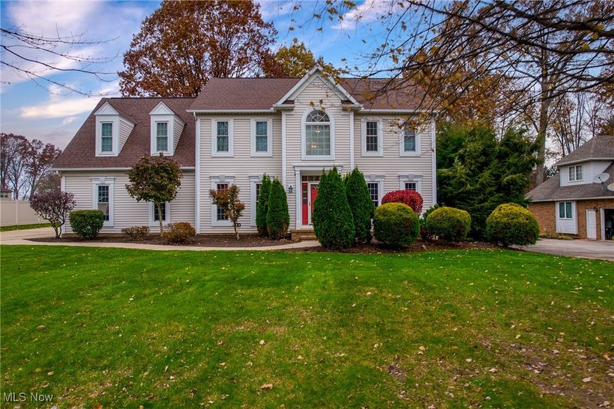 Welcome to Mayfair Estates, a desirable community in Green Local Schools. This well cared for four bedroom, two and a half bath home offers over 2700 square feet of living space, plus a partially finished basement. Conveniently located near freeway access, restaurants, grocery stores, parks, and more. Upon arrival you will love the welcoming curb appeal. A bright two story foyer welcomes you with warm natural wood floors and abundant natural light. To one side is the formal dining room with trayed ceilings, perfect for hosting and gatherings. To the other side is a formal sitting room, ideal for a reading room, music space, or home office. It flows nicely into the formal living room, which features a handsome gas fireplace and mantle. A unique T shaped staircase offers access from both the foyer and the living room, creating an open and connected main floor. The living room transitions comfortably into the kitchen, which offers ample cabinet and counter space, full appliances, and a dinette that looks over the backyard. Down the hall is a powder room, first floor laundry, and access to the attached garage, which also features an outlet for an electric car. Upstairs, all four bedrooms are generously sized. The primary suite includes a spacious bedroom area and a sitting nook with a fireplace.  The master bath offers double vanities, soaking tub, walk in shower, and a large walk in closet. The lower level is partially finished and freshly repainted, offering flexibility for a recreation room, play space, gym, or additional living area. Outside, enjoy a nice sized backyard with a double tiered deck, gas line rate for grill. Upgrades included but are not limited to:  Furnace & AC (2012), roof in 2013, windows in 2010 and 2019, updated carpet throughout. New sump pump in 2022, and electric vehicle charger. You do not want to miss your chance to call this home yours! Call today to schedule your private showing, this one wont last!