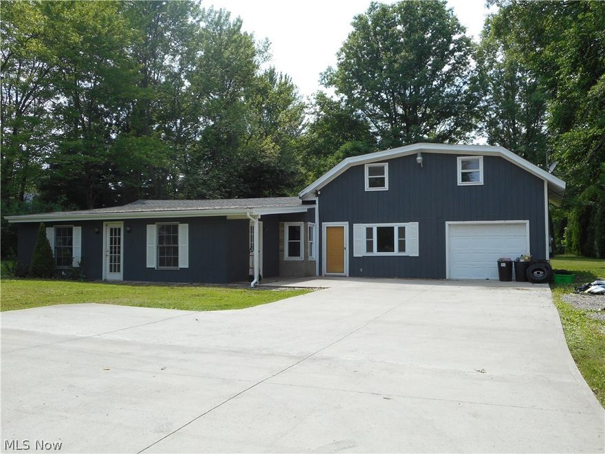 Large, Rustic home, situated on nearly 2 acres offering tons of privacy! -ideal for entertaining and large gatherings!  3 bedrooms and one full bath on the main level, plus another full bath and 2 lower ceiling bedrooms on the second level. Beautiful hickory cabinets and pantry in the large eat in kitchen, comfy family room with oak and slate flooring,rustic walls and ceiling, Huge finished porch offers an additional large living space. Newer appliances, roof, gutters, windows, water heater, furnace, fresh flooring and paint, plus lots of cement parking. Lot is zoned R-2, so it's okay to add a guest home or garage with loft (permit required) call agent for more information. Large lot offers plenty of space to add a garage, workshop or extra storage. Low property taxes, tons of amenities and services close by. Bring your decorating ideas and make this house your home! 
Lot is zoned R-2, so it's okay to add a guest home or garage with loft (permit required) call agent for more informati