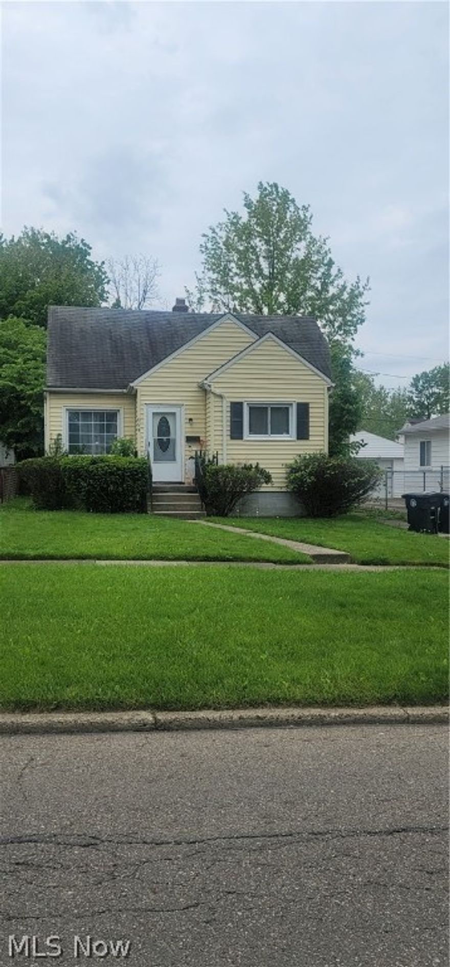 Cape Cod for sale in West Akron! This property has two bedrooms on the main level and a finished attic area upstairs. The home can be used as an income producing property or a starter home for someone just starting out. Please contact a local real estate agent for more detailed information on home. Property is being sold AS-IS.