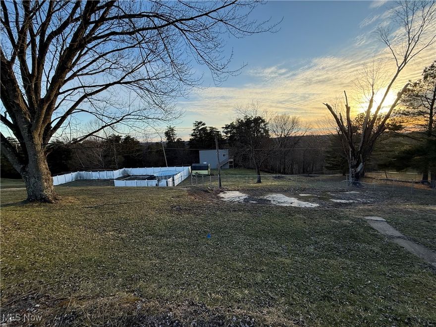 Country Charm Meets Convenience – Nearly 1 Acre Cleared, Fenced, and Ready for Your Dream Home!

Properties like this don’t come on the market often! This nearly 1-acre, cleared and fenced lot offers the perfect combination of privacy, space, and location. Nestled in a peaceful setting where you’ll pass cows and open fields on your way home, it still provides easy access to town, making it the ideal spot for those craving the tranquility of country living without sacrificing convenience.

Whether you’re planning to build a custom home, place a mobile or modular home, or bring in a double-wide, this property is ready for your vision. With electricity, natural gas, city water, and a septic tank already in place, much of the hard work has already been done. Plus, an on-site building offers additional space for storage or other uses.

Opportunities like this—offering space, privacy, and convenience—are rare in this area.

Bring your imagination and make this blank canvas your own! Ready to explore the possibilities? Let’s make it happen—contact us today!