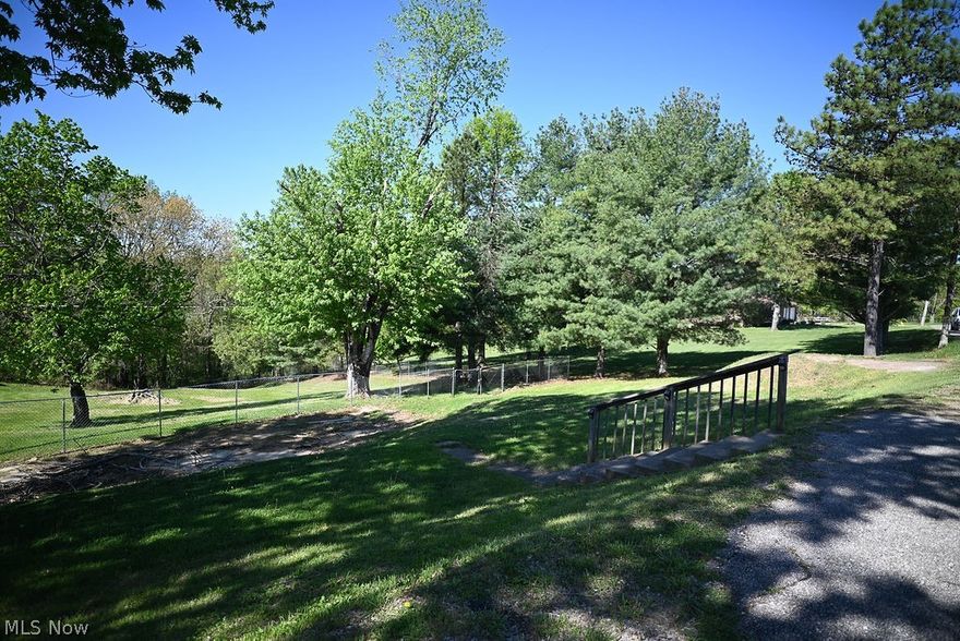 Country Charm Meets Convenience – Nearly 1 Acre Cleared, Fenced, and Ready for Your Dream Home!

Properties like this don’t come on the market often! This nearly 1-acre, cleared and fenced lot offers the perfect combination of privacy, space, and location. Nestled in a peaceful setting where you’ll pass cows and open fields on your way home, it still provides easy access to town, making it the ideal spot for those craving the tranquility of country living without sacrificing convenience.

Whether you’re planning to build a custom home, place a mobile or modular home, or bring in a double-wide, this property is ready for your vision. With electricity, natural gas, city water, and a septic tank already in place, much of the hard work has already been done. Plus, an on-site building offers additional space for storage or other uses.

Opportunities like this—offering space, privacy, and convenience—are rare in this area.

Bring your imagination and make this blank canvas your own! Ready to explore the possibilities? Let’s make it happen—contact us today!