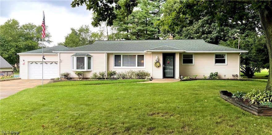 Welcome Home! Just off the beaten path, tucked away in a quiet neighborhood surrounded by trees, hides this beautiful home on over a half an acre of yard. This home has been cared for and it shows! It has an extra long double drive with a two car garage. The large front yard has boxed flower beds through out and along the sides of the drive. Upon entering, you will notice the gorgeous hard wood floors leading into the home. The living room has built in cabinets and over sized windows to brighten the space. The living room flows into the kitchen with an open concept. The kitchen is a cooks dream with recessed lighting, custom decorative cabinets, and countertop spaces every direction you turn! To The left is the master bedroom and master bathroom. This bedroom is impressive (20'x13.5') and features beautiful wooden closet doors with an inlaid mirror and a bay window! The master bath is tastefully done in white and features a large walk-in shower with double seats and inlays. To the righ