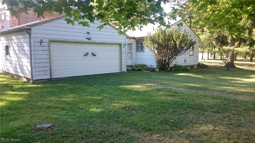 Nice little Ranch home on .46 acre corner lot.  Hardwood floors. Large breezeway between 2 car garage and home.