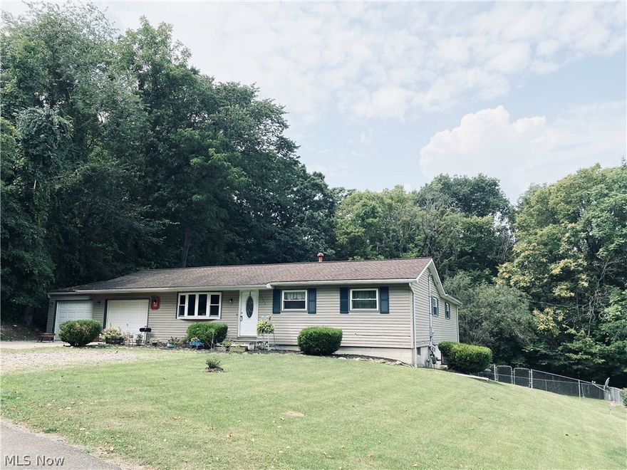 Secluded setting in great neighborhood is this convenient ranch home with no steps & wheelchair accessible. 4 bedrooms 2 full baths, & 1st floor laundry, basement has family room, wet bar & gas fireplace along w/hookups for a 3rd bath. Private, wooded backyard includes 2 tiered deck, above ground pool, & Pergola, yard is completely fenced. This home has had many upgrades; windows, siding, roof, electric, hot water tank, baths, kitchen counters, appliances, & more!