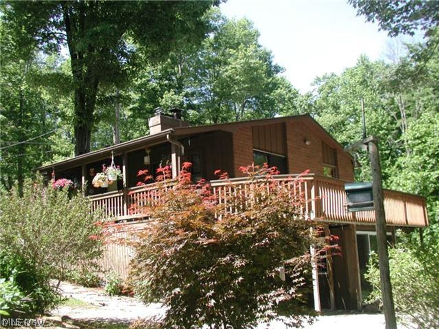 Charming year round home at Leesville Lake! This lovely lake home offers 2-3 bedrooms, 1 1/2 baths, open floor concept, relax in the living room around the fireplace. Escape to the lower level that boasts family room with free-standing fireplace, walk-out to enclosed Florida room that leads to a patio and firepit. Beautiful wrap around deck to sit and enjoy the seasonal views of Leesville Lake. There's only a short walk to the beach and docks. Dock is also transferred in sale-must see this one! Let's start the summer right with this great home! Reserve to seller all oil and gas underlying the premises.