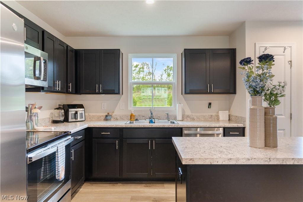 Photo of 1427 Wood Fern Drive, Akron, OH 44312 (MLS # 5211336)