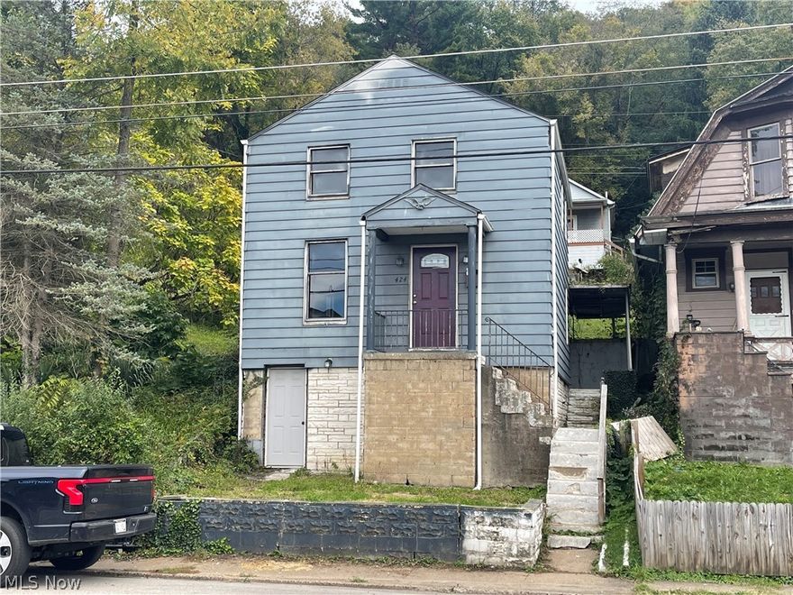 Two bedroom one bath fixer-upper on Warwood Avenue. Newer furnace/electrical panel/vinyl plank flooring. AS-IS. Owner has never lived in the property. Great opportunity. Sale includes two lots (House lot and large lot to the left). Agent owned.