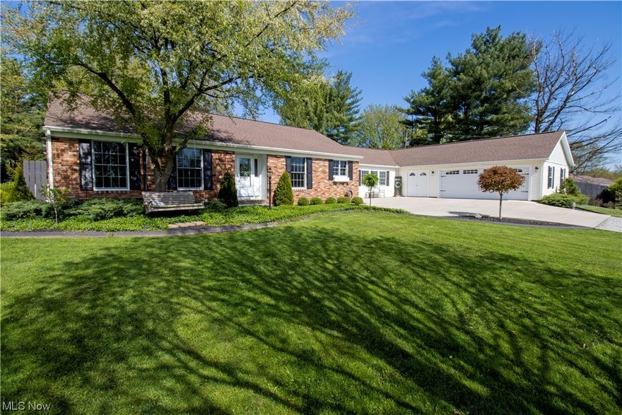 Immaculate and move-in ready is the best way to describe this ranch style home situated on just over 2 acres with mature trees and beautiful landscaping.Built in 1978 this home has gone through extensive remodeling including , new windows, roof shingles, waterproofed foundation, 24 x 74 insulated garage shop area, patio, concrete driveway, finished basement and more. It features 5 bedrooms, two full baths, updated HVAC, fireplace and its located in Triway Local School District. 1973 sq ft of living space on the main level with an additional 1409 sq fy of finished area in the lower level.