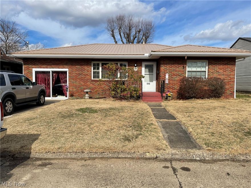 Garage has been turned into a family room and laundry room.  Home has new electric service to house and breaker box in 2013, New Metal roof in 2019.  New Heat and A/C and rain gutters in 2019. Laundry room has outside entrance and cabinets.  Nice Brick home with lots of space.  Fireplace is for looks only, does not work. measurements are approximate.